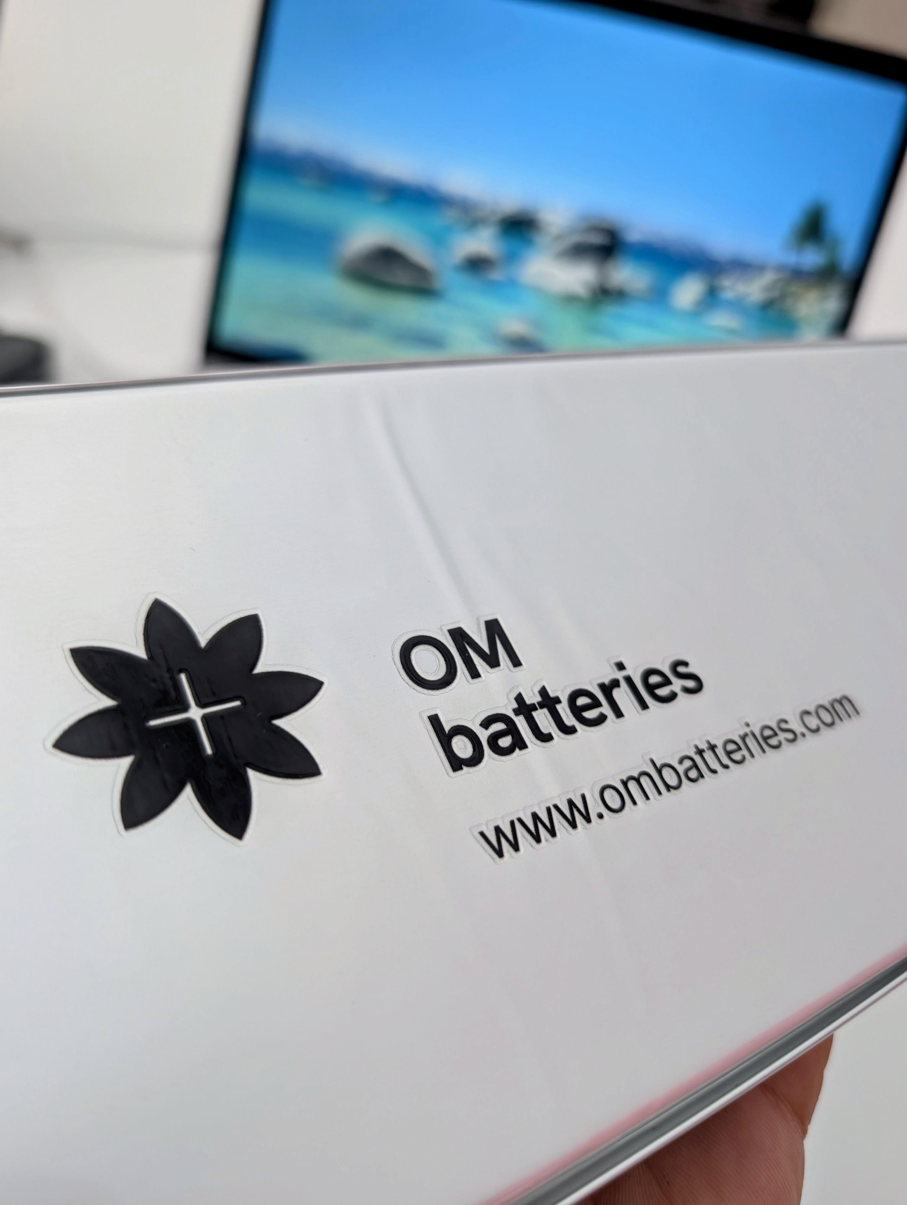 OM Batteries pouch cell with branded label — close-up